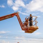 man working at heights with lifting platform.